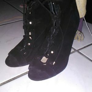A black lace boots with open toes